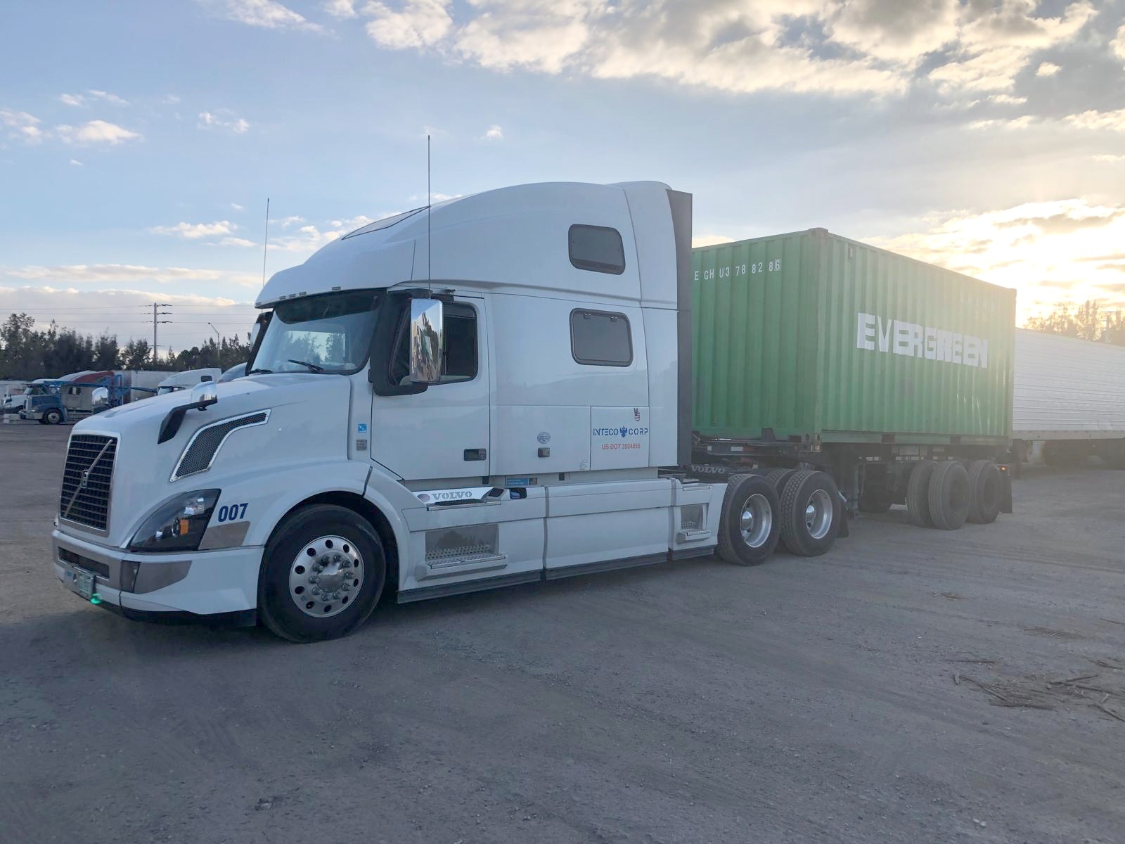 Inteco Corp truck and container at sunset